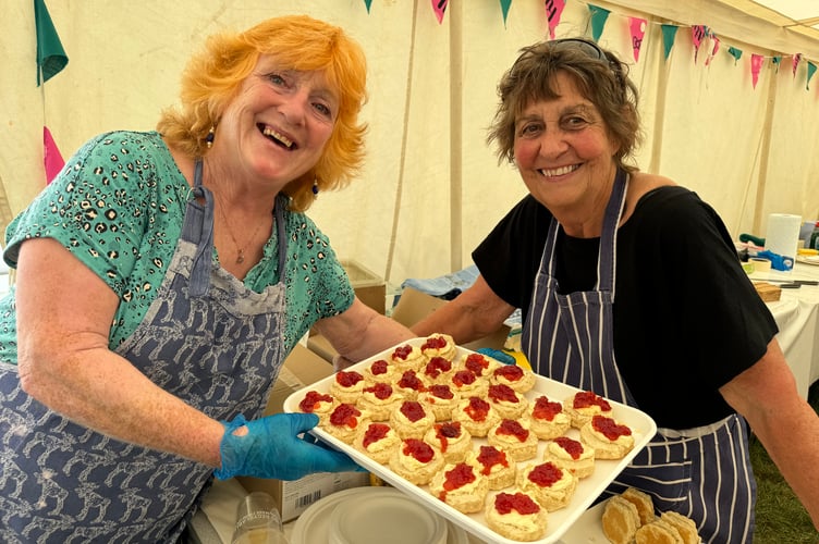 Serving cream teas in aid of Moretonhampstead Information Centre were a raft of volunteers. AQ 0669