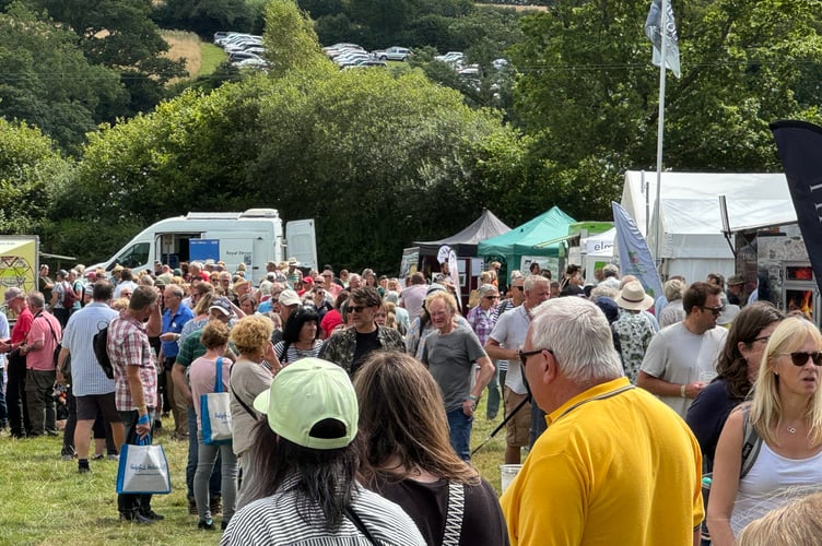 A busy aisle at the Chagford Show on a hot and sunny day. AQ 0630