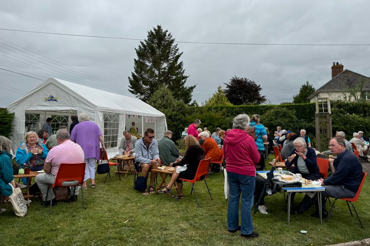 Tucking in to cream teas at the Summer Fete held at Homefield, Bow. AQ 1011