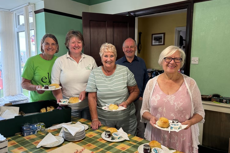 Helpers preparing cream teas with hosts Linda Steer, second left and James Steer, back right.  AQ 1007