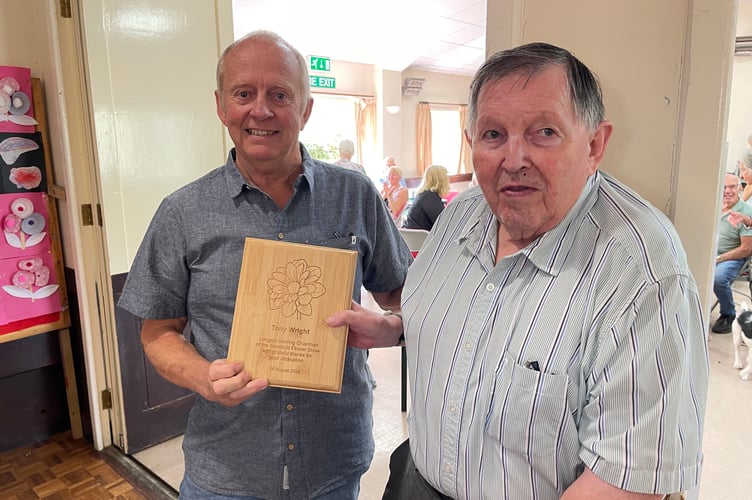 Vice-President David Munday, left, presented the President Tony Wright with an award for his long service as Chairman of Sandford Flower Show ‘with grateful thanks for his dedication’. 
