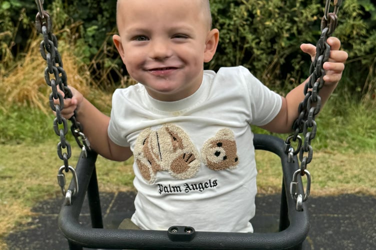 Enjoying some time on one of the swings. AQ 1415