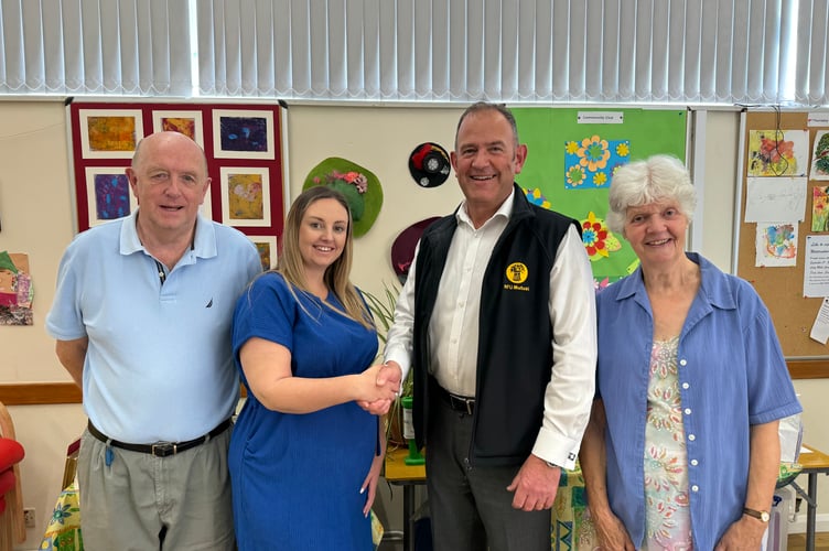 Richard Pym, Agent at NFU Mutual Crediton Agency, is thanked for the NFU Mutual’s Agency Giving Fund donation by Chelsea Yelland, Operations Manager at Age Concern Crediton, with left, John Potter, Age Concern Crediton Trustee and Treasurer and right, Jenny Berg, Age Concern Crediton Chair.  AQ 1739