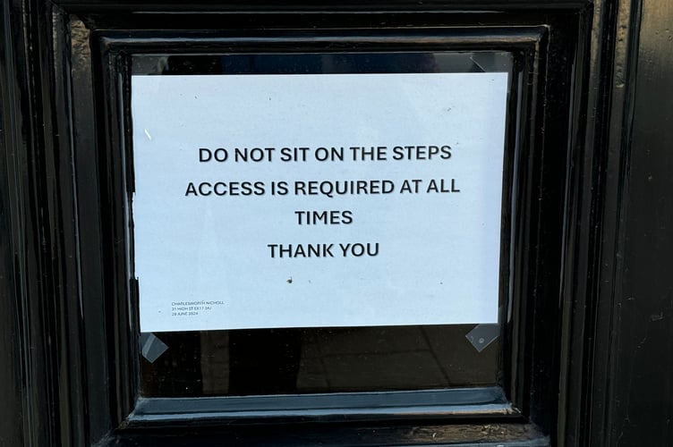 A notice on the door outside QualitySolicitors Charlesworth Nicholl. AQ 2417