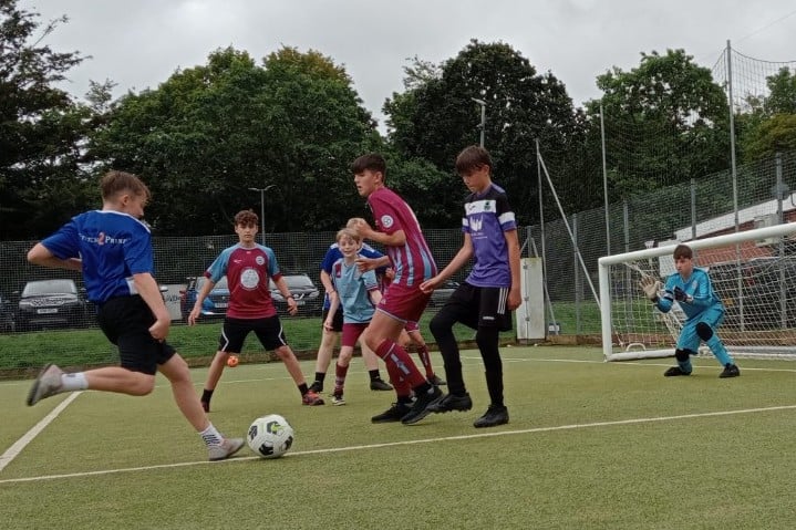 During one of the matches at the charity football tournament.