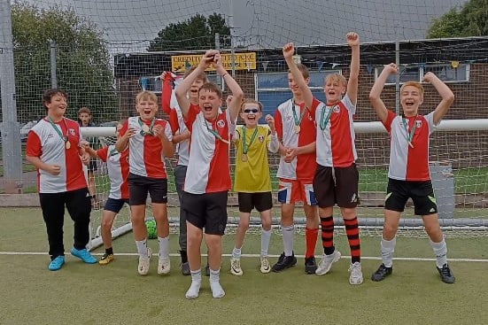 One of the jubilant teams which took part in the charity football tournament in Crediton.