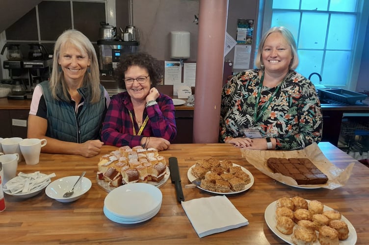 Crediton Foodbank Friday Café volunteers with the delicious treats generously donated by Cafe@100.
