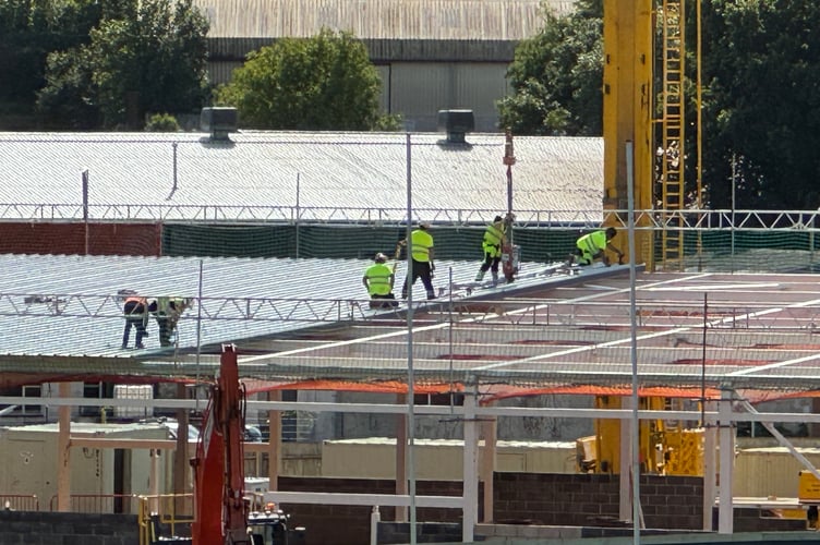 Contractors working on the roof at the new Crediton Lidl store. AQ 2569