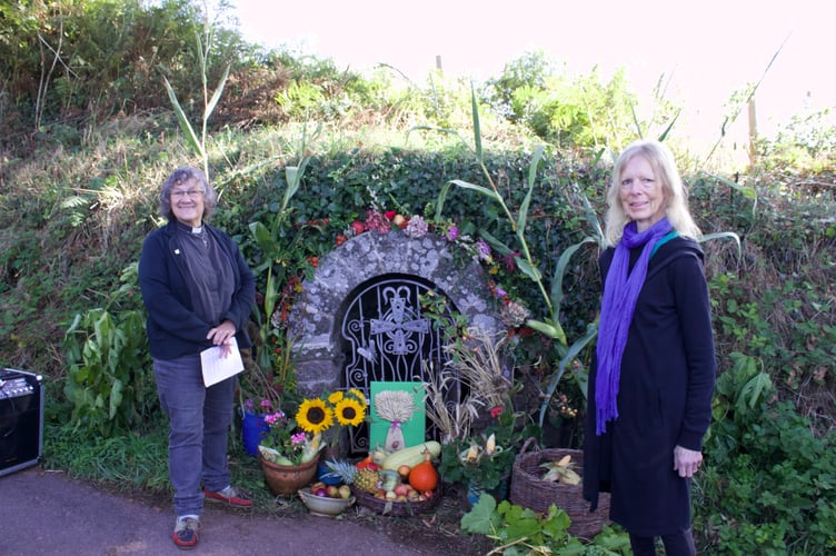 Rev Sandra Collier with Joy Moore, who decorated the Holy Well for the celebration
