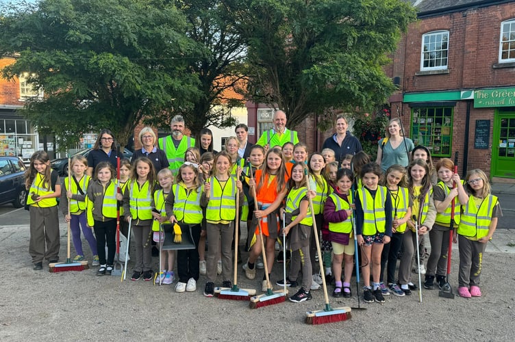 The 3rd Crediton Brownies who took part in the litter pick and tidy up of Crediton Town Square with [CUT!] members, leaders and helpers.  AQ 3209
