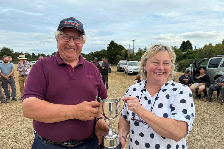 The Champion Ploughman Anthony Retallick receiving his award from Mrs May.  AQ 3178