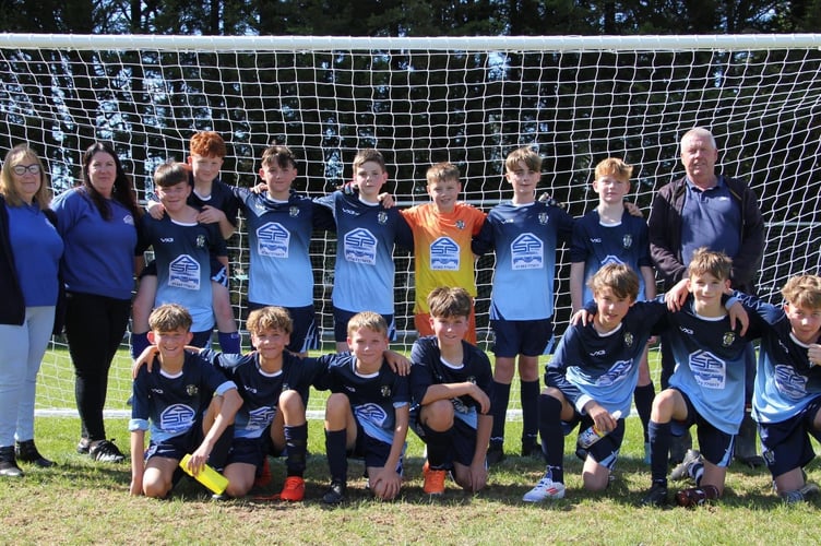 Crediton Youth Under 13’s receiving their new kit from A and S Paving.
