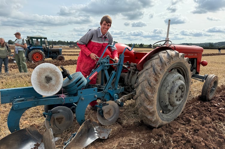 A quick adjustment to his plough for Chris Orchard. AQ 3018