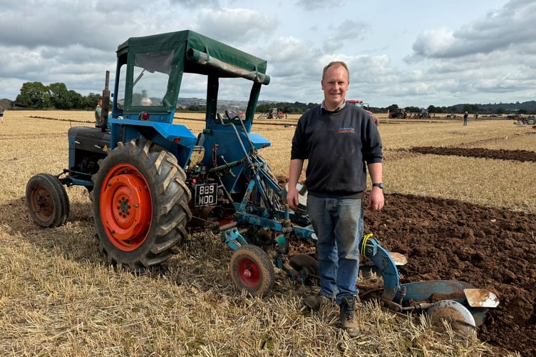 Tom Walling stopped to adjust his plough during the match.  AQ 3014
