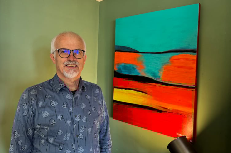 Phil Smith with one of his paintings. AQ 2498