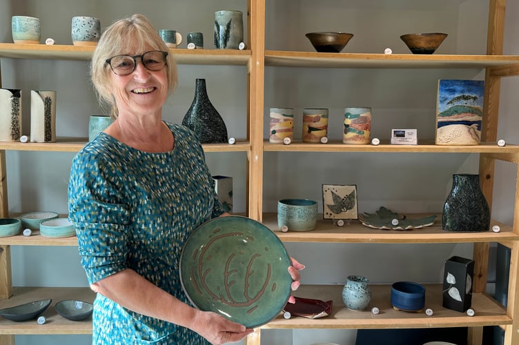 Anne Smith with examples of some of her ceramics. AQ 2484