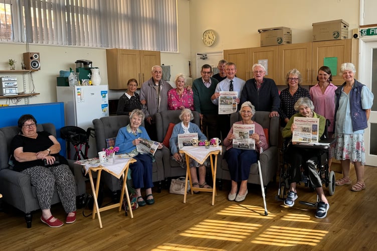 ‘Crediton Courier’ Editor Alan Quick, back, fifth from left, with some of the members, trustees and helpers of Age Concern Crediton following his talk about the newspaper. AQ 3242
