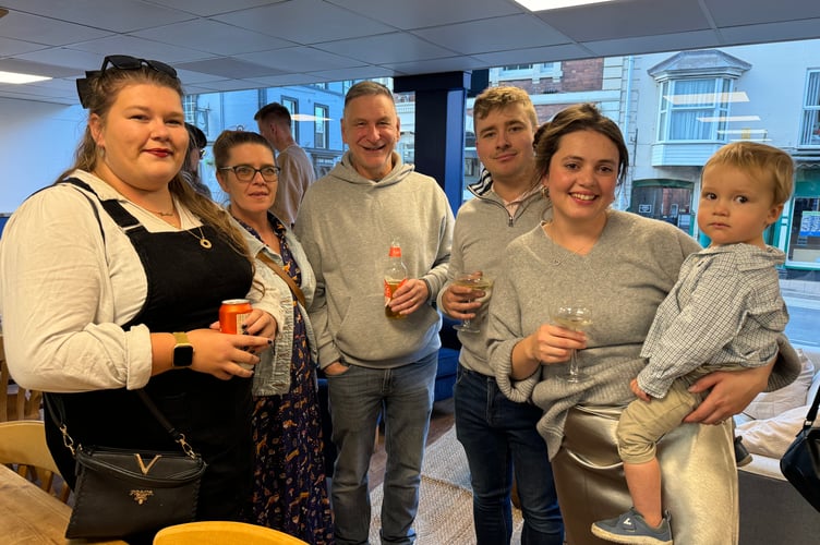 Chloe Burston-Thomas, right, with some of those who attended the opening evening party. AQ 2624