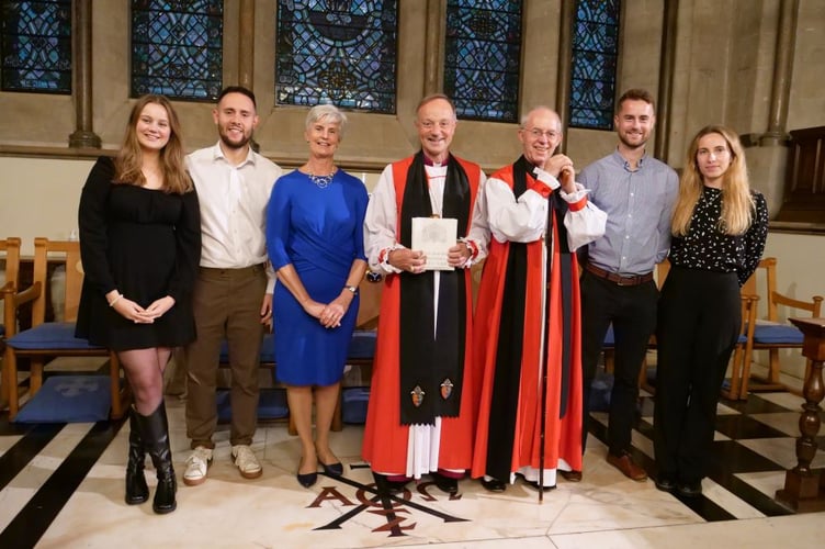 Bishop Mike, the Bishop of Exeter, centre, with his family and, centre right, The Archbishop of Canterbury, the Most Rev Justin Welby.