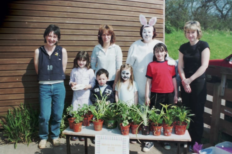 Behind the plant stall at Copplestone Busy Bees Easter Fair in March 2003. DSC01251