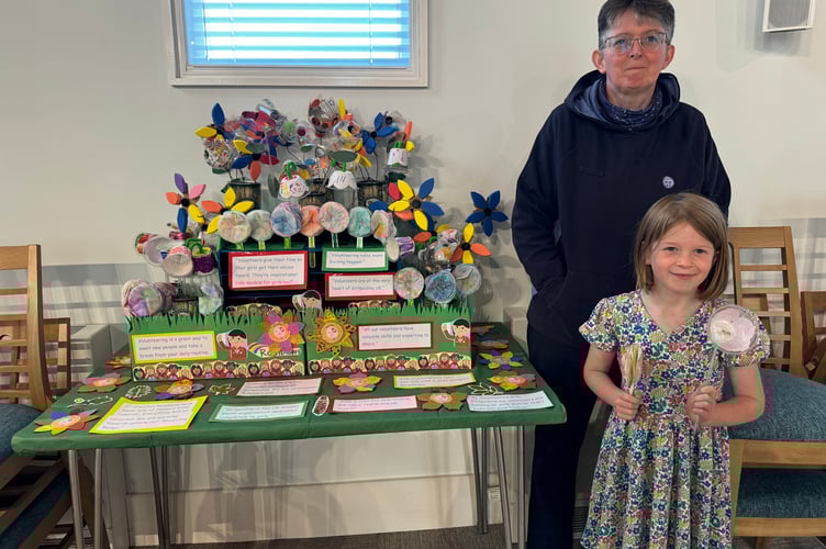 Sarah Turner and one of the 1st Crediton Rainbows display. AQ 4123