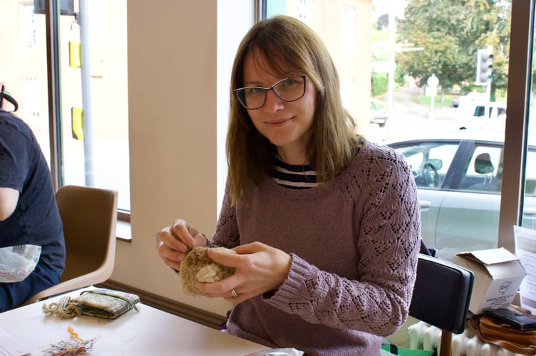 Jo Muncaster using her sewing skills on koala soft toy
