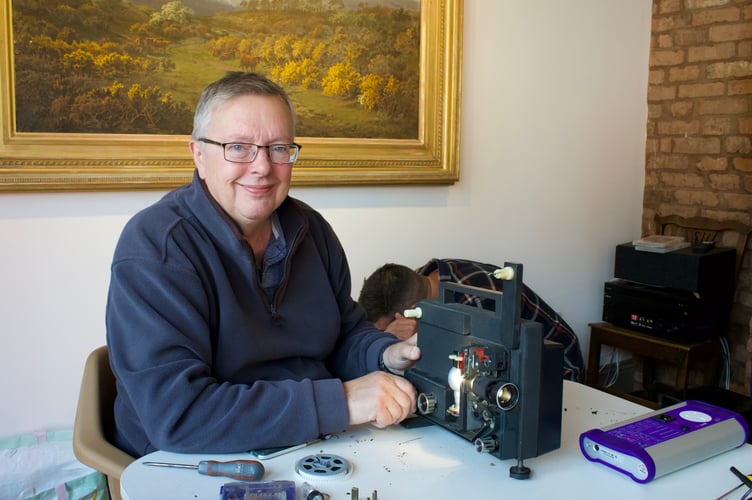 Ian Barnard fixing projector