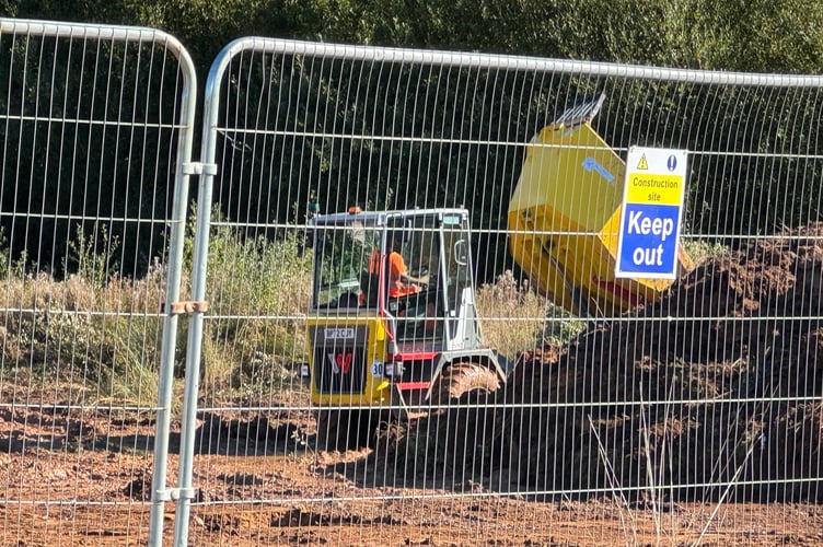 A tipper vehicle piling high earth removed from the site for Crediton McDonald’s. AQ 4477