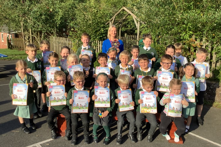 Beth from Crediton Library with the Copplestone Primary School Summer Reading Challenge winners.
