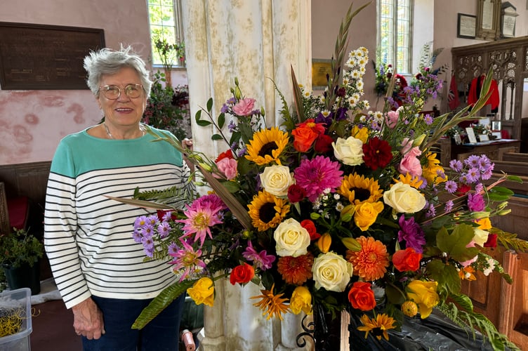 Margaret Widger created a colourful floral arrangement.  AQ 3965
