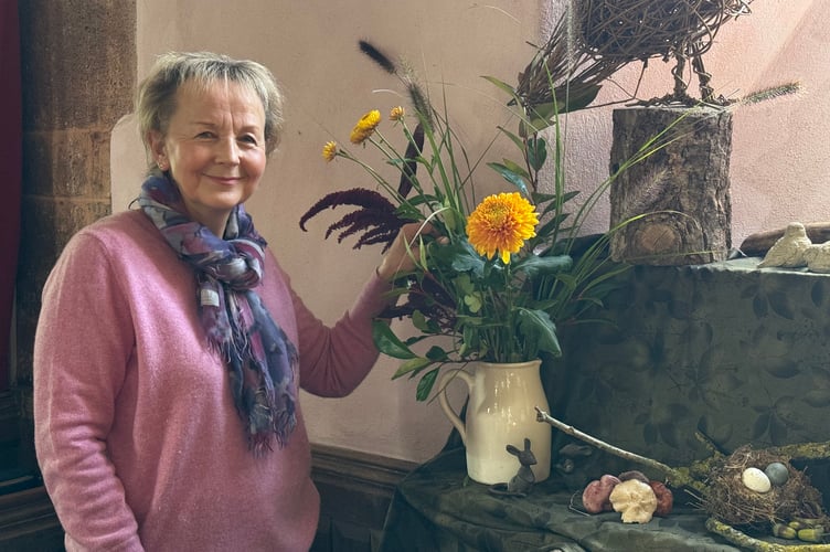 Rachel Hodder making a start on her window display.  AQ 3956
