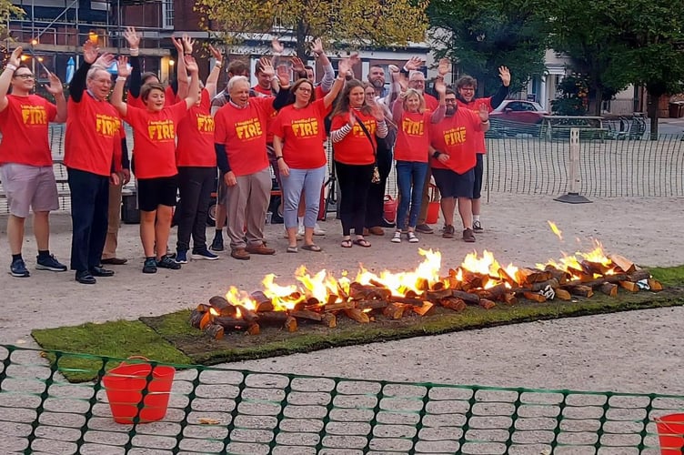 The fire walkers pose for a picture before their walk. Image: FirewalkUK