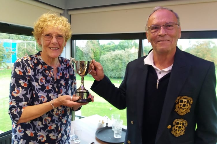 Sue Jackson and Peter Blinkhorn, Ladies and Men's Seniors Captains at Downes Crediton Golf Club with the Lin Ashman Trophy, this year won by the men.