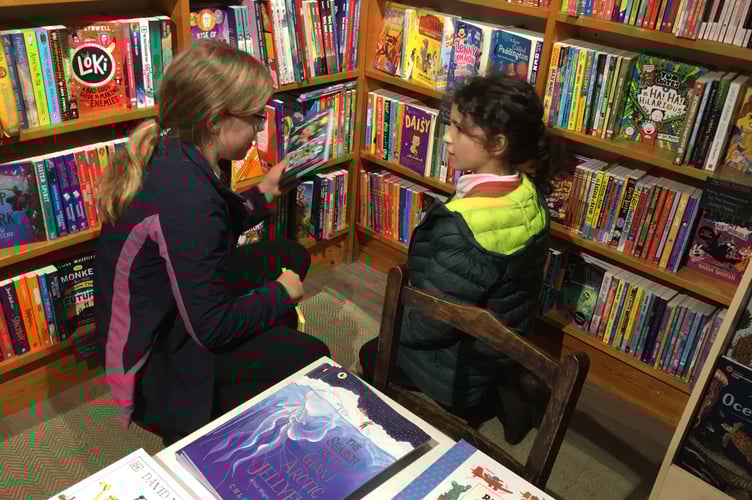 Choosing books at The Bookery.