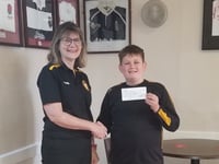 Brennan (11), raised £615 for rugby tour
