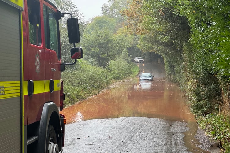 The car stuck in the floodwater between Crediton and Sandford.  AQ 5420
