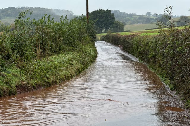 Floods trap cars, shut roads in Crediton area