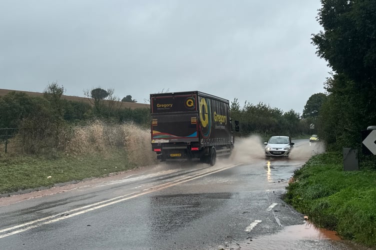 Floods across the road on the A377 between Crediton and Barnstaple Cross.  AQ 5408
