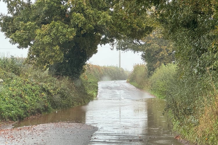 A flood across Higher Road, Crediton on Wednesday, October 16. AQ 5403