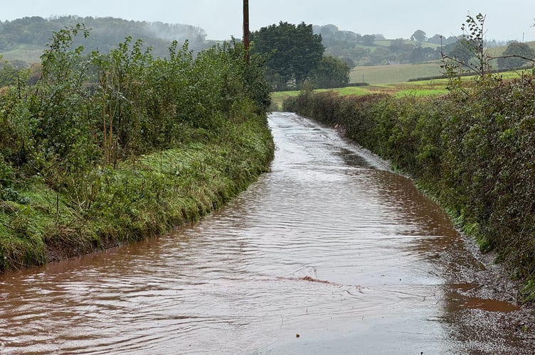 Floods on the road to Venny Tedburn. AQ 5412