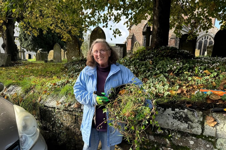 Elizabeth Owens helped to tidy up along the road beside Sandford Parish Church. AQ 5556
