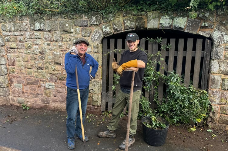 Two of those who helped tidy up one pavement in Sandford.  AQ 5550
