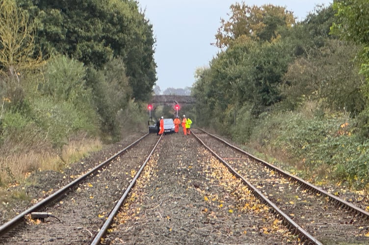The car on the railway line between Crediton and Salmonhutch Railway Crossing. AQ 5920