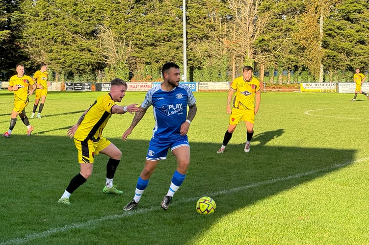 A Crediton player with the ball during the game against Stoke Gabriel and Torbay Police.  AQ 6339