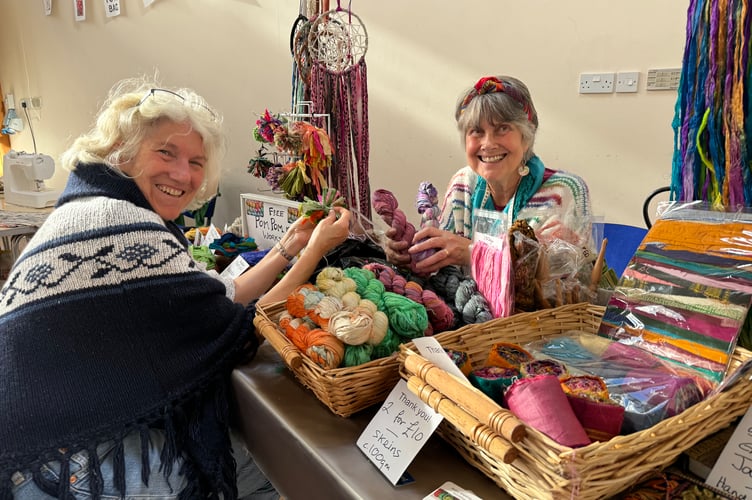 Judi Binks, right, ran a stall selling items and gave offering free pom-pom lessons.  AQ 6207
