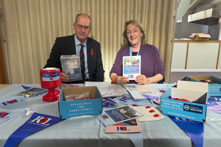 Henry Parker, chairman, Crediton Branch of the Royal British Legion and membership secretary, Laura Leigh, gave out patterns for making poppies.  AQ 6169
