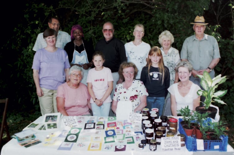 Behind one of the stalls at North Tawton Church fete in August 2003. DSC00272
