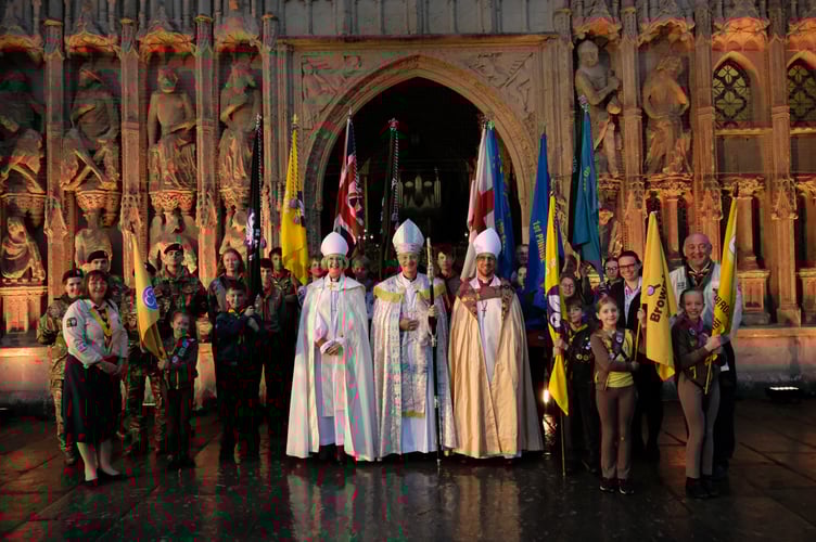 Bishop Mike, Bishop Jackie and Bishop James with scouts, guides, cubs and military service cadets following the service. 
