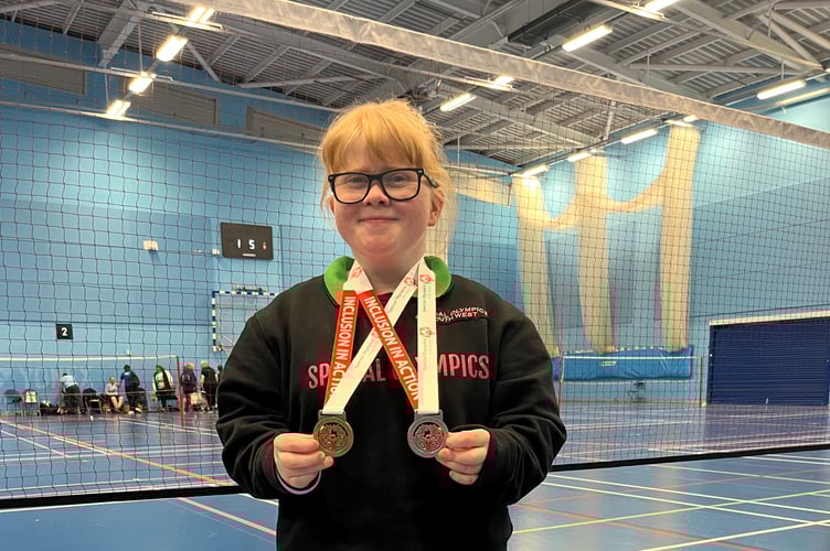 Dee with her gold and silver medals won at the Special Olympics GB National Badminton Competition.