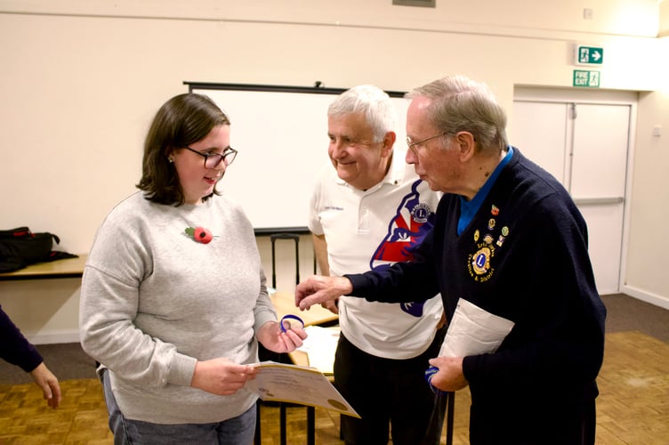 Lily-Ann Palfrey receiving her Lions Young Leaders in Service Bronze Award, wristband and badge